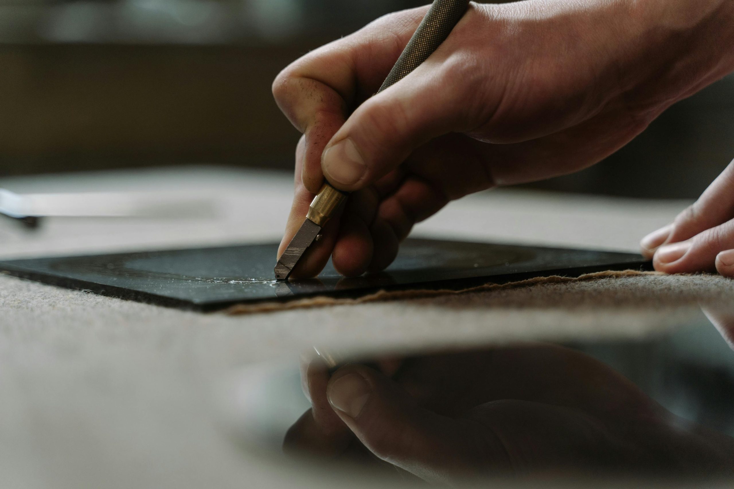 Man cutting glass in Cambridge